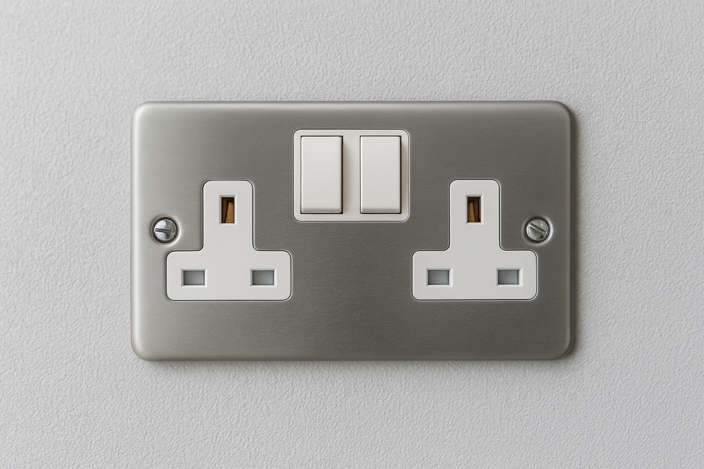 Claddagh Range Y410M 13A 2-Gang Double Pole Metal Clad Switched Socket mounted on wall – front view