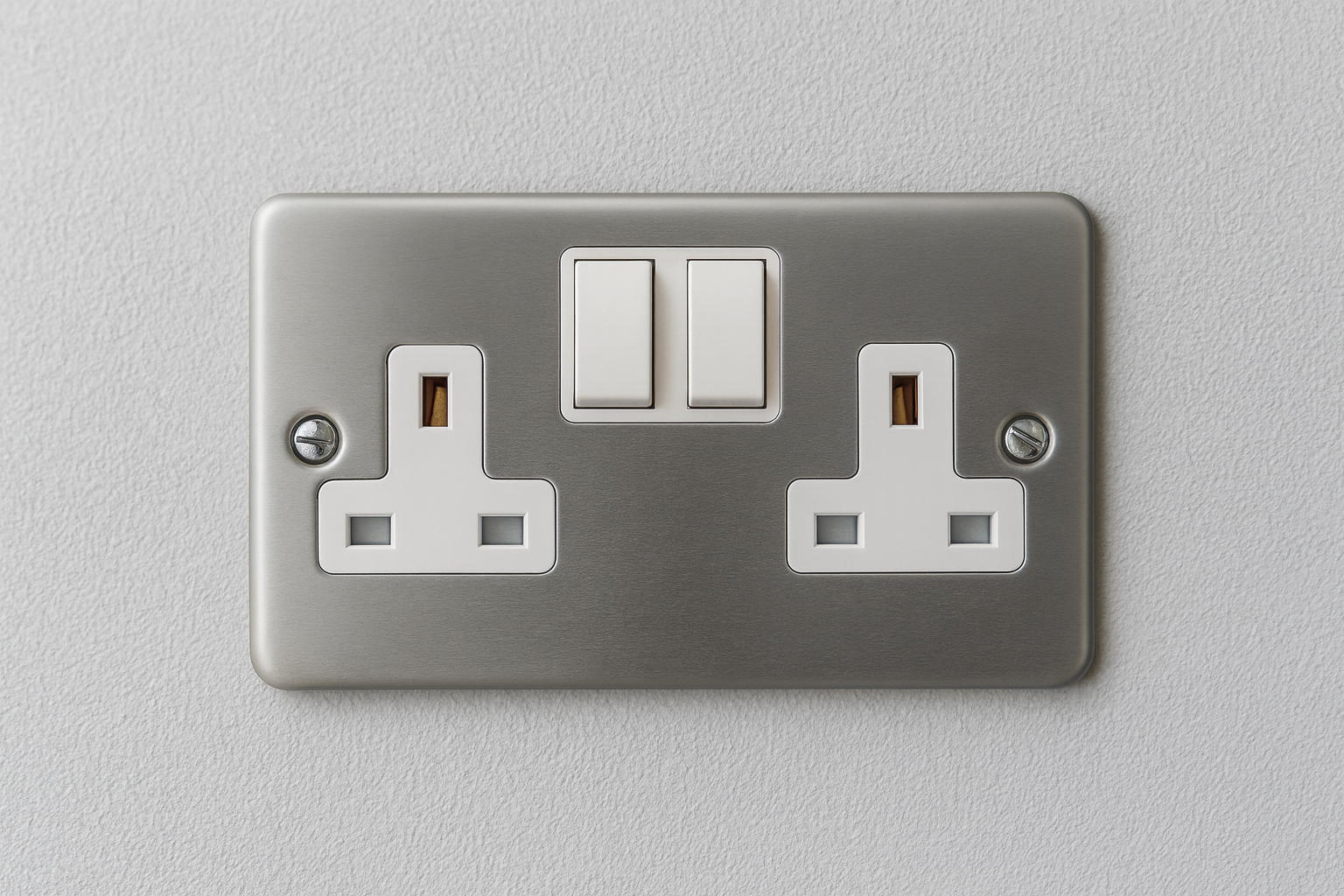 Claddagh Range Y410M 13A 2-Gang Double Pole Metal Clad Switched Socket mounted on wall – front view