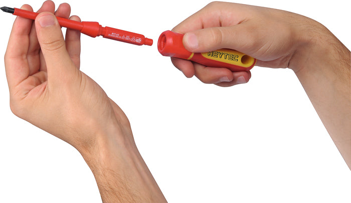 Close-up of Heytec VDE screwdriver with removable rotating end cap for precise, insulated turning.